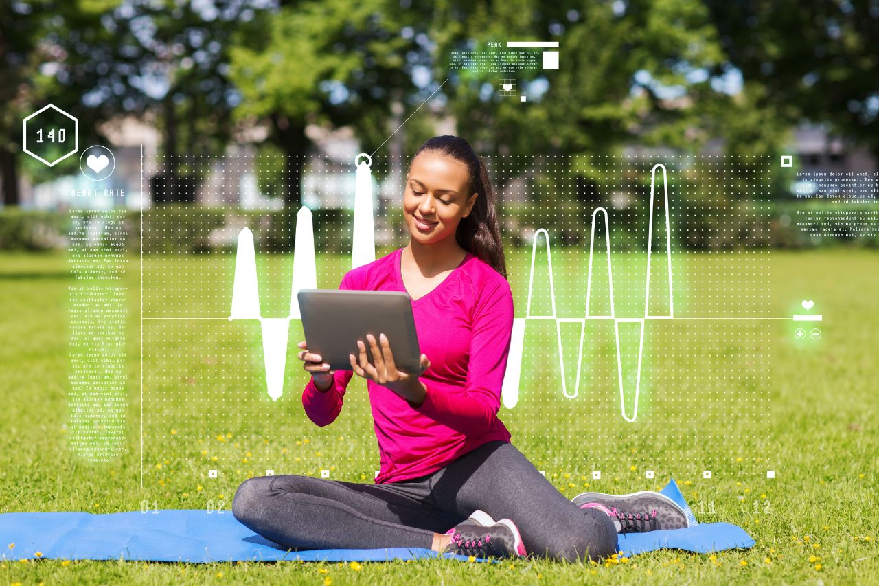 fit-woman-using-tablet-outdoor